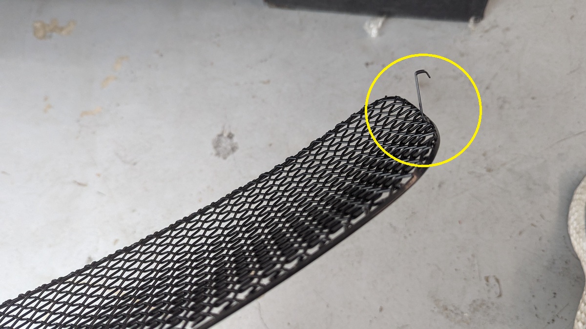 Zunsport uses clips. Other grilles use zip ties or require you to remove the front bumper. Clips looked easier. You need a narrow flat head screw driver to push them into position to clip onto the black radiator trim, and a lot of bright lights to see the clip as you work it.