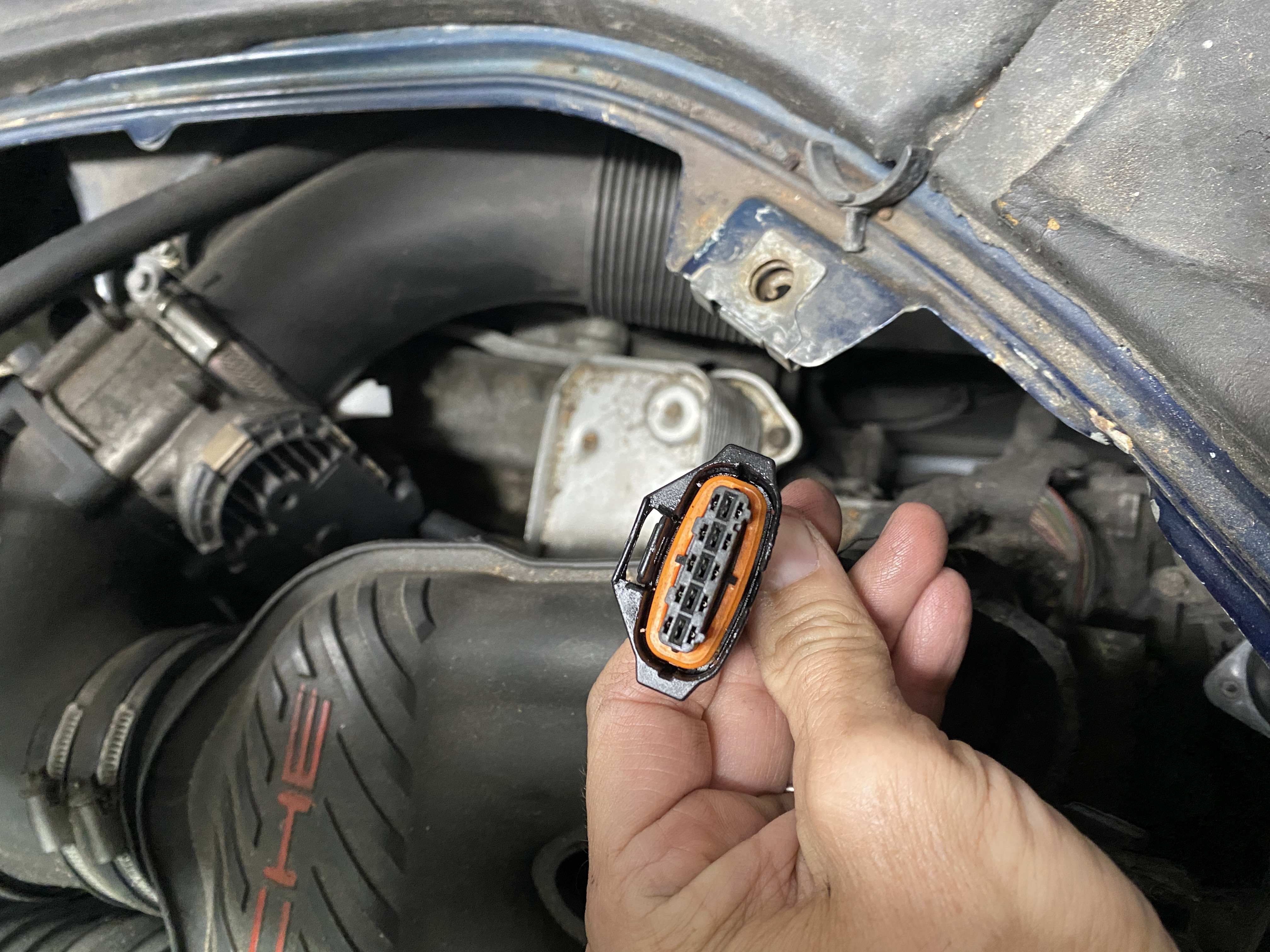 Connector on the car is round on both sides, that's what bothers me. No signs of the wires being cut, seems original