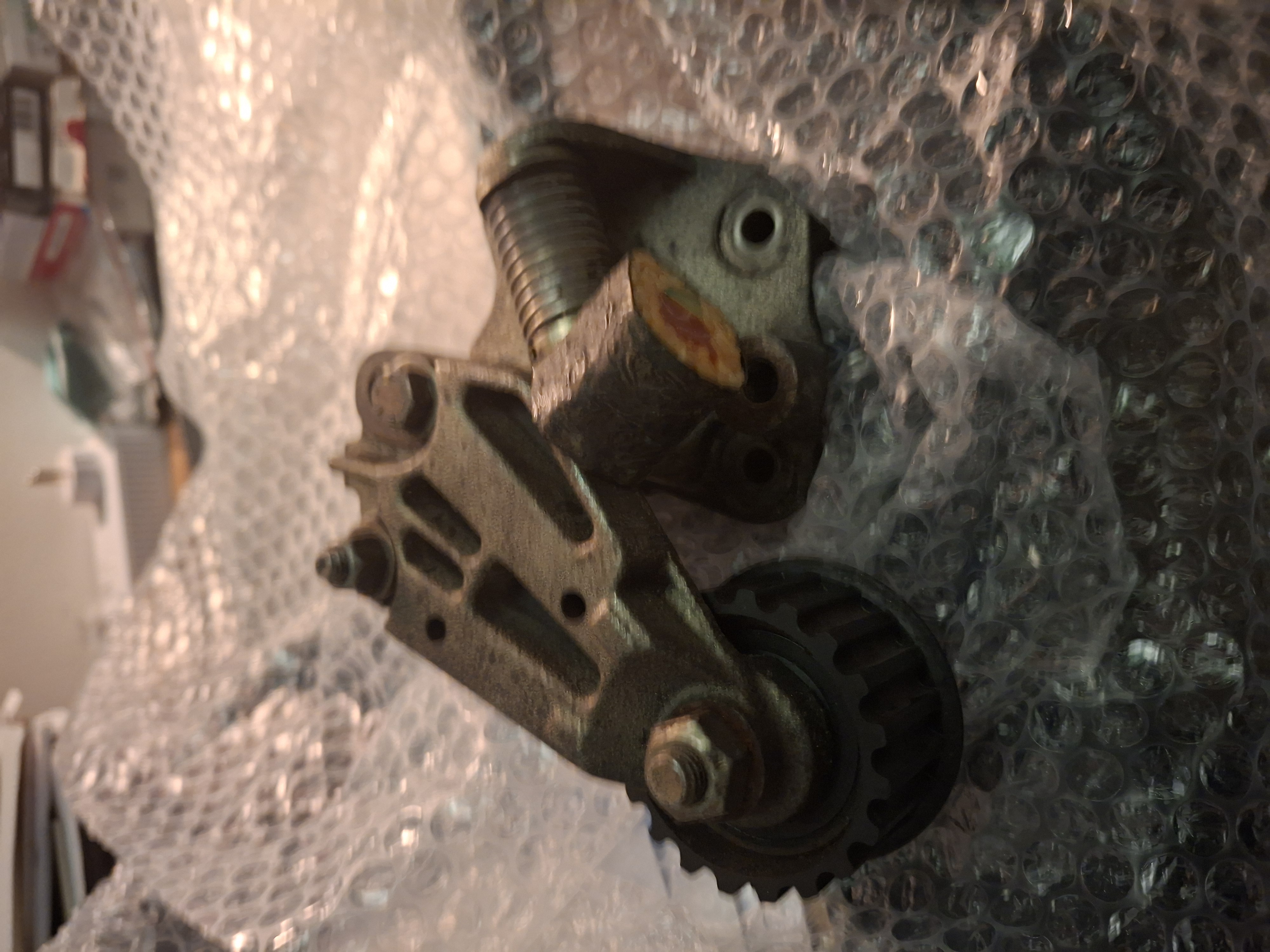 Here's a "2nd gen" Iron tensioner with a "sushi roll" magnet stuck to it